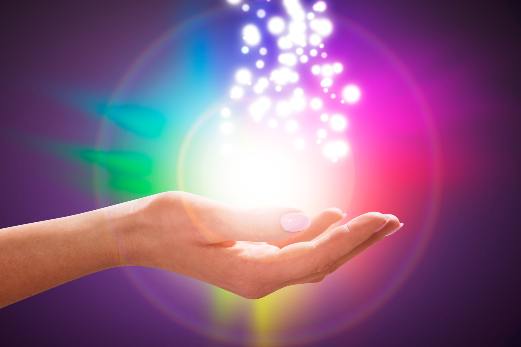 Person's Hand Into Magical Healing Energy Field